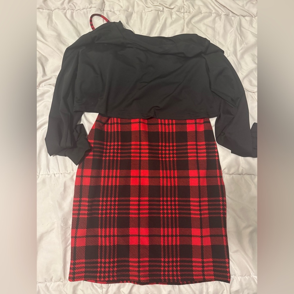 Black thin sweater and red plaid skirt